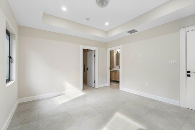 empty room with a tray ceiling