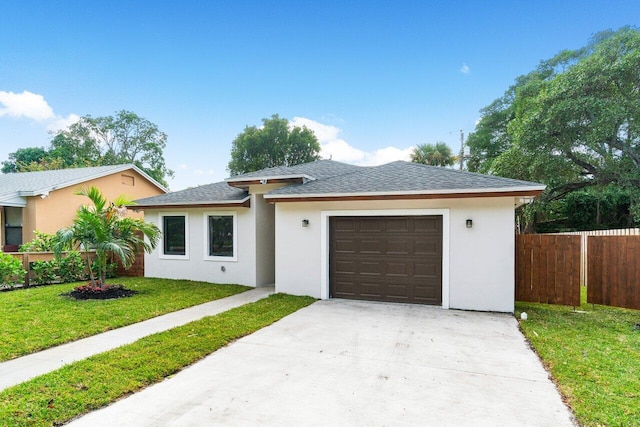 view of front facade featuring a front lawn and a garage