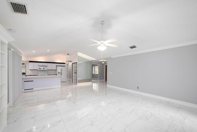 unfurnished living room featuring ceiling fan and ornamental molding