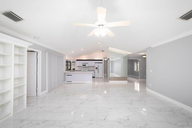 unfurnished living room with built in features, vaulted ceiling, ceiling fan, and ornamental molding