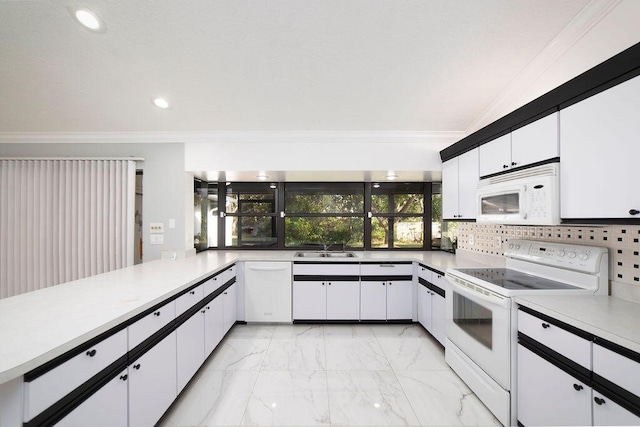 kitchen featuring sink, white cabinets, white appliances, and ornamental molding