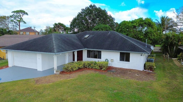 ranch-style home with a front lawn, central AC unit, and a garage