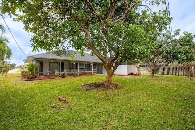 view of yard featuring a sunroom