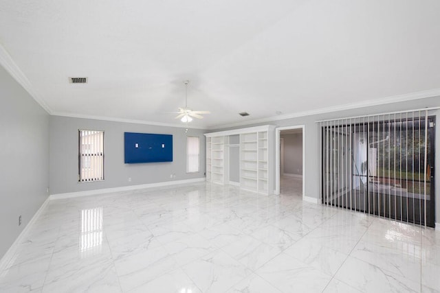 spare room with crown molding, built in features, and ceiling fan