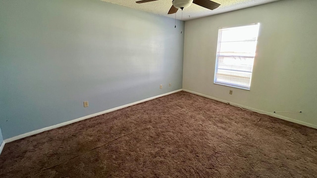 spare room featuring ceiling fan, carpet floors, and a textured ceiling