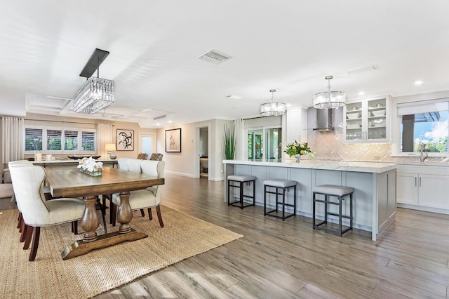 dining area featuring hardwood / wood-style flooring and sink