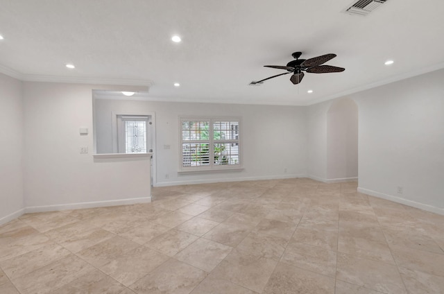 spare room with ceiling fan and crown molding