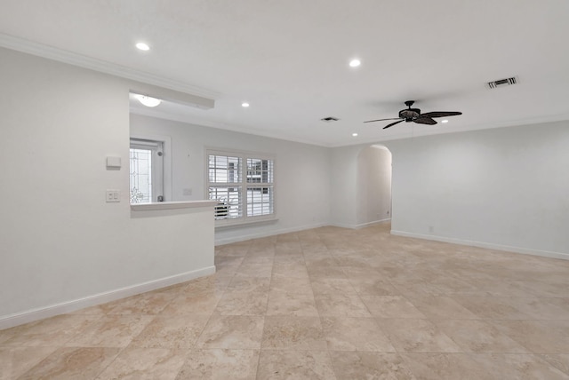 empty room with ceiling fan and ornamental molding