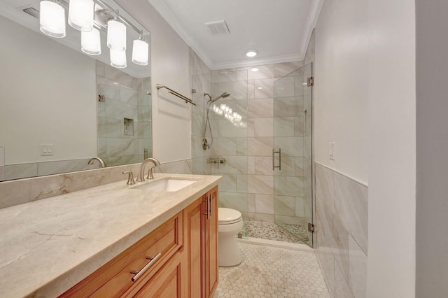 bathroom featuring crown molding, a shower with shower door, and vanity