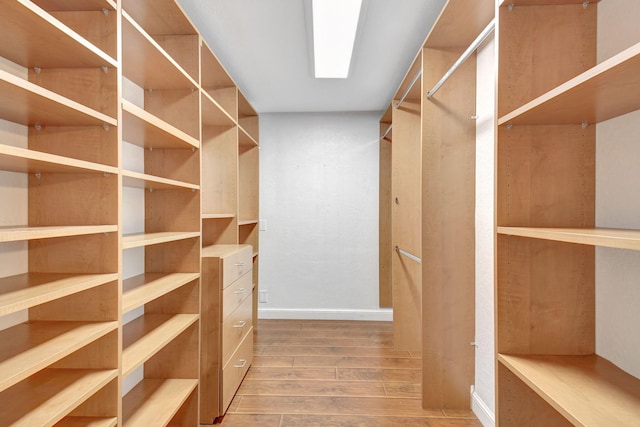 spacious closet featuring hardwood / wood-style flooring