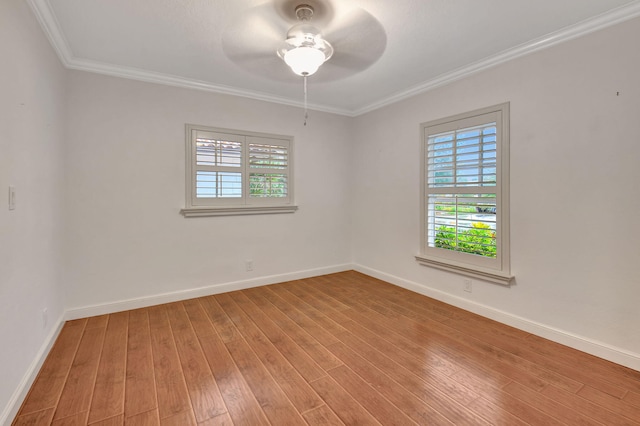 unfurnished room featuring ceiling fan, crown molding, and hardwood / wood-style flooring