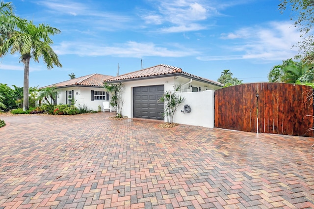 mediterranean / spanish-style house featuring a garage