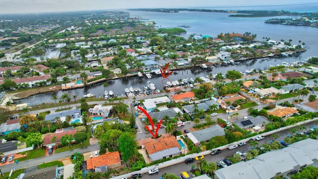 birds eye view of property with a water view