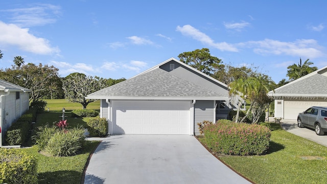 view of front facade with a front lawn and a garage