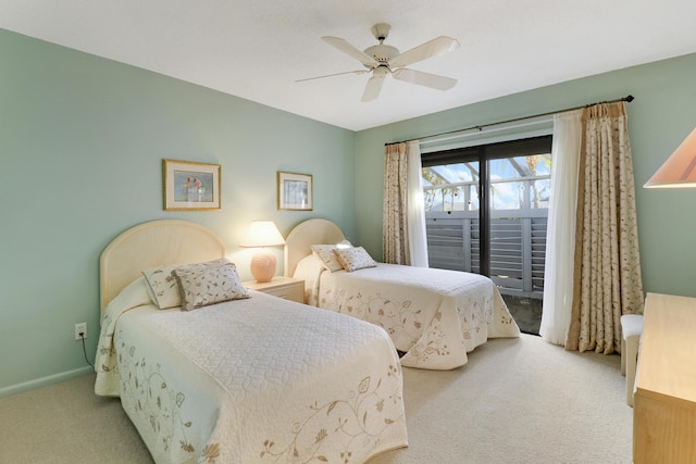 carpeted bedroom featuring access to exterior and ceiling fan