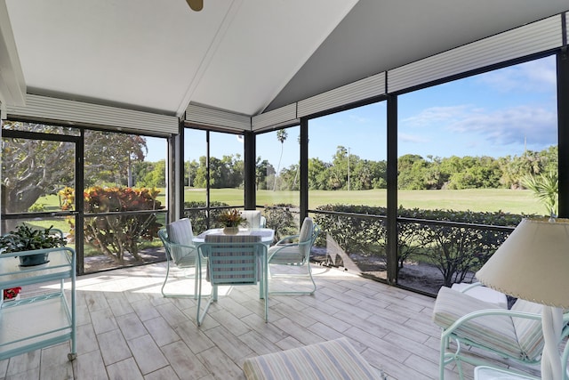 unfurnished sunroom with plenty of natural light and vaulted ceiling