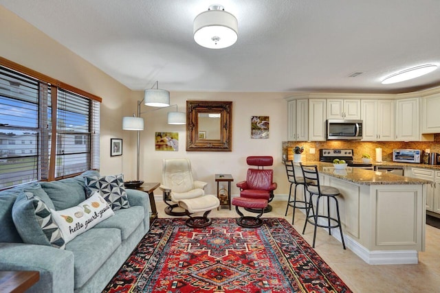 living room featuring light tile patterned flooring