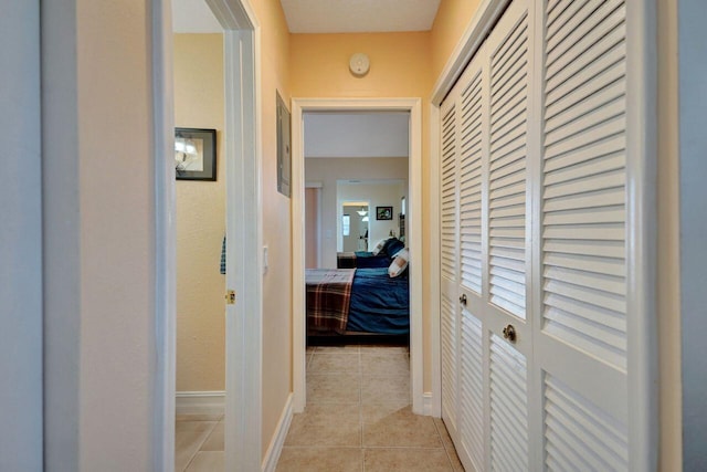 hallway featuring light tile patterned floors