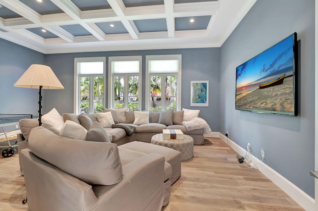 interior space with beam ceiling, light hardwood / wood-style flooring, and french doors