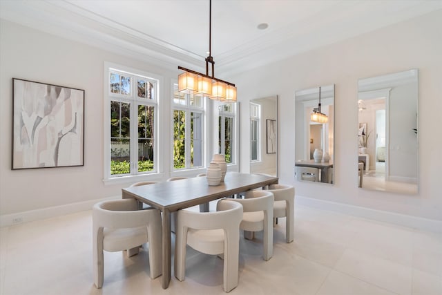 tiled dining area featuring ornamental molding