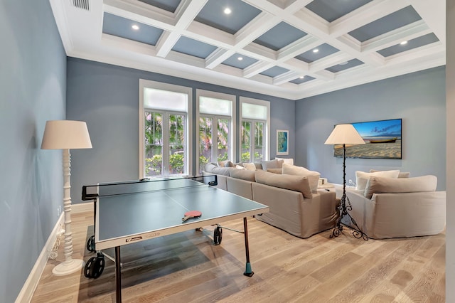 recreation room featuring beamed ceiling, light hardwood / wood-style floors, and coffered ceiling