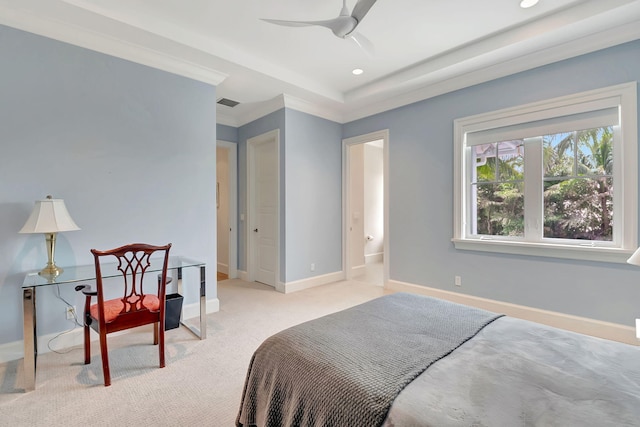 carpeted bedroom with ensuite bath, ceiling fan, and crown molding