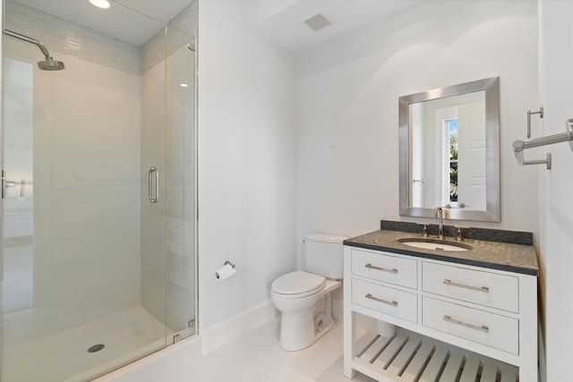 bathroom featuring vanity, an enclosed shower, tile patterned floors, and toilet