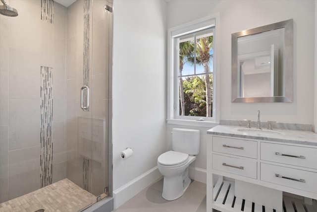 bathroom featuring walk in shower, a wealth of natural light, vanity, and toilet