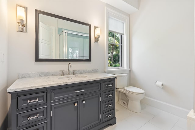 bathroom featuring walk in shower, tile patterned floors, vanity, and toilet