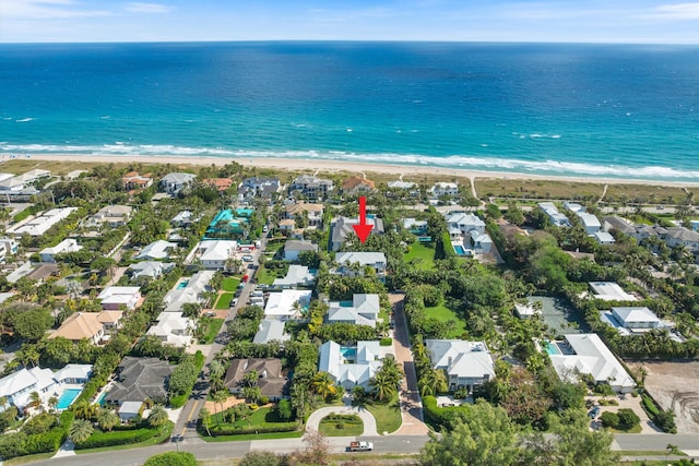 drone / aerial view featuring a view of the beach and a water view