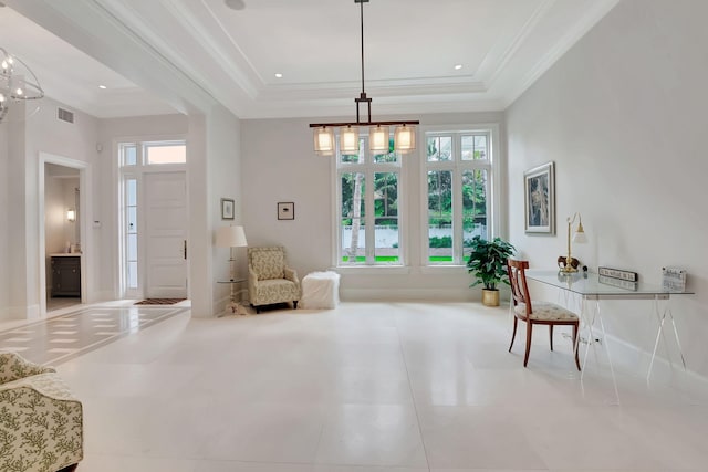 living area featuring plenty of natural light, a raised ceiling, and light tile patterned floors