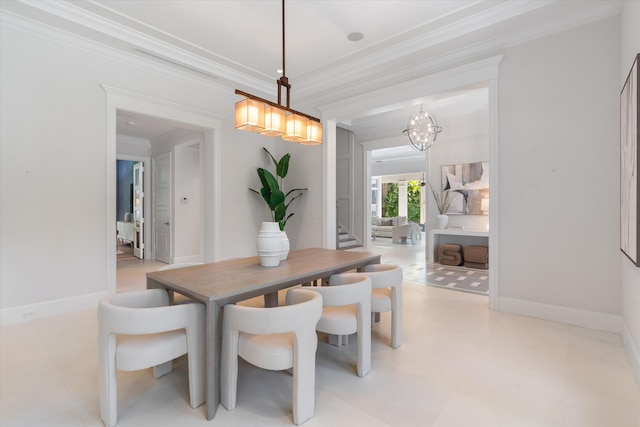 dining space featuring an inviting chandelier and crown molding