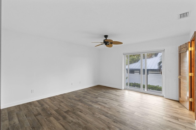 spare room featuring light hardwood / wood-style floors and ceiling fan