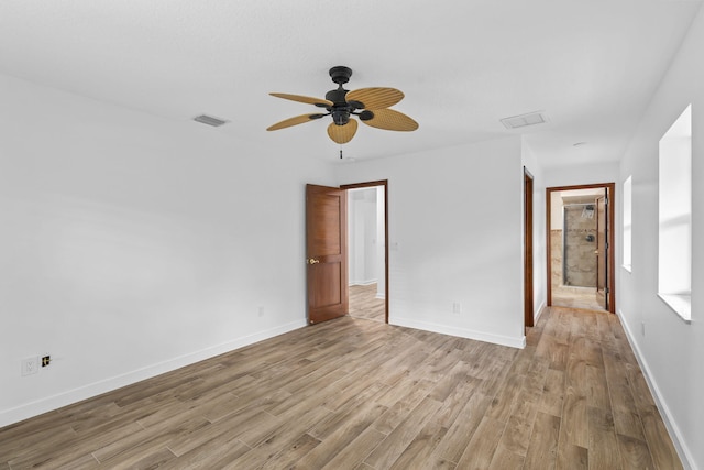 spare room featuring ceiling fan and light hardwood / wood-style floors