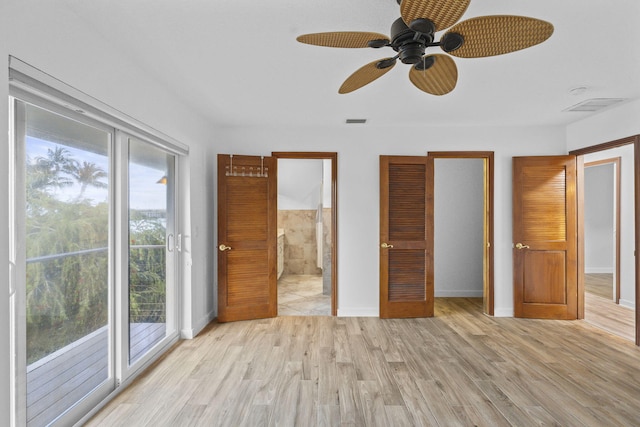 unfurnished bedroom with access to exterior, multiple windows, light hardwood / wood-style floors, and ceiling fan