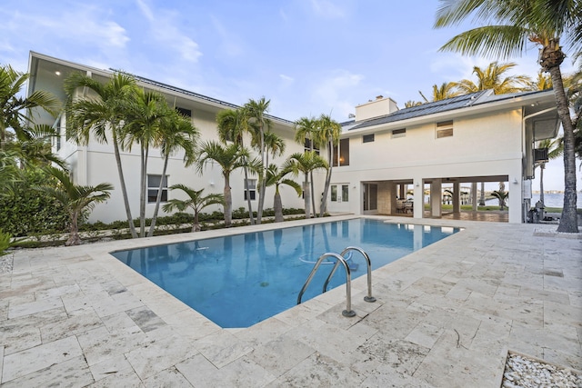 view of pool featuring a patio area