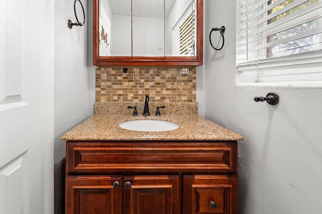 bathroom with backsplash and vanity