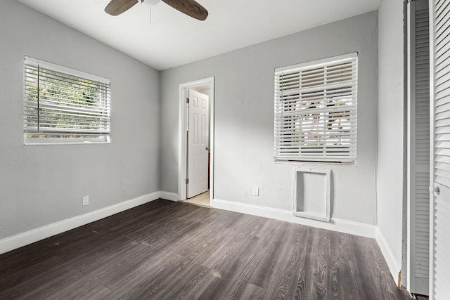 unfurnished bedroom with ceiling fan, a closet, and wood-type flooring