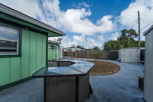 view of patio / terrace with a storage unit