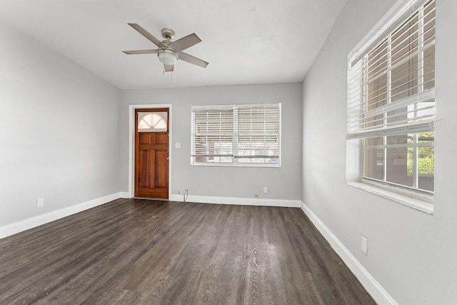 entrance foyer with dark hardwood / wood-style flooring, ceiling fan, and a healthy amount of sunlight