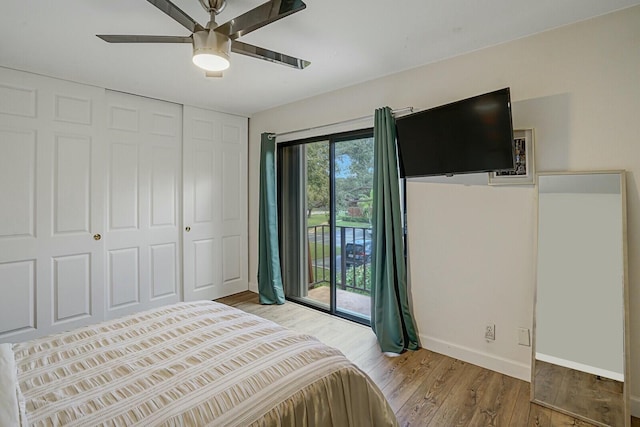 bedroom with a closet, access to exterior, hardwood / wood-style flooring, and ceiling fan