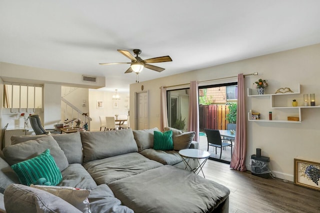 living room featuring hardwood / wood-style flooring and ceiling fan