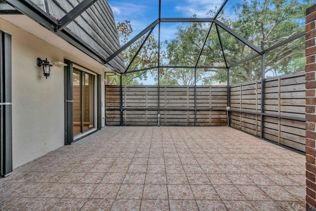 view of patio / terrace with a lanai