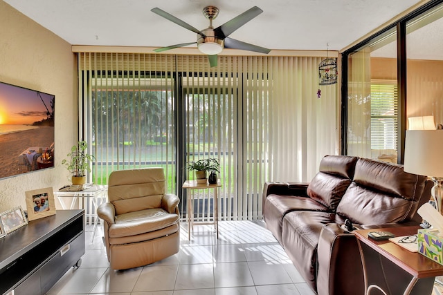 tiled living room featuring ceiling fan