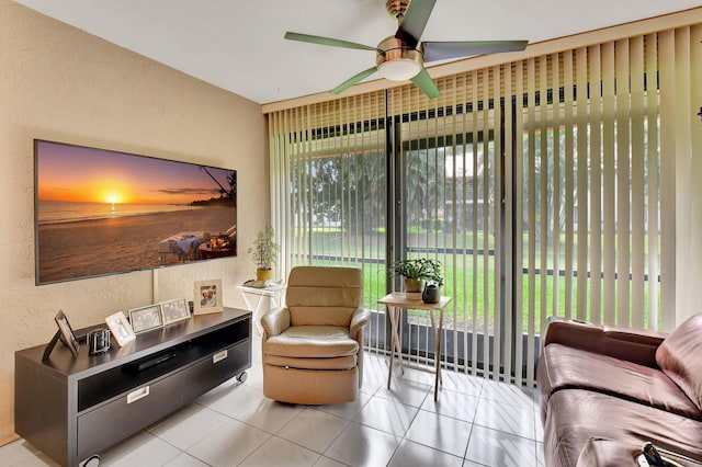 interior space featuring light tile patterned floors, a wealth of natural light, and ceiling fan