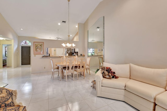 tiled living room with high vaulted ceiling and ceiling fan