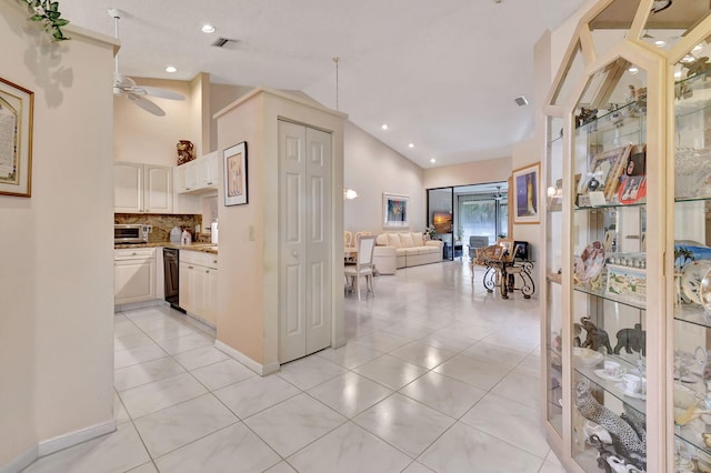 7906 Lexington Club Blvd Unit B, Delray Beach, FL 33446 - corridor with lofted ceiling, light tile patterned floors, and recessed lighting