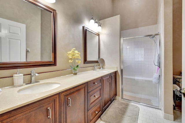 bathroom with tile patterned floors, vanity, and a shower with shower door