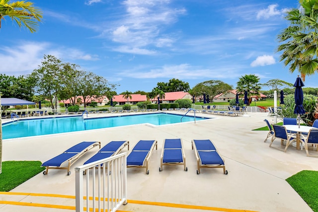 view of swimming pool featuring a patio