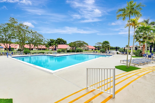 view of swimming pool with a patio